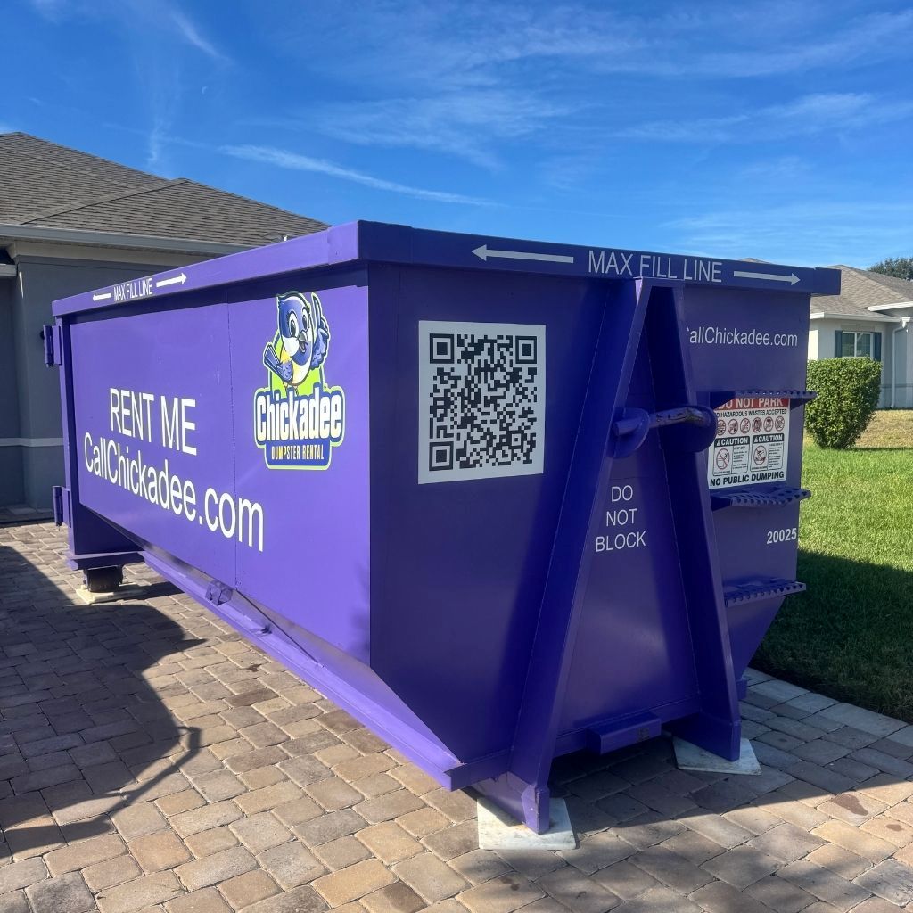 dumpster delivery with driveway protection in Port St Lucie residential job site