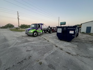Chickadee dumpster at old citrus processing plant demolition in Indrio, Fort Pierce FL