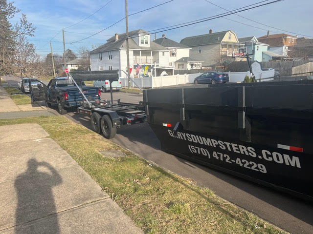 Dumpster on street in Nanticoke