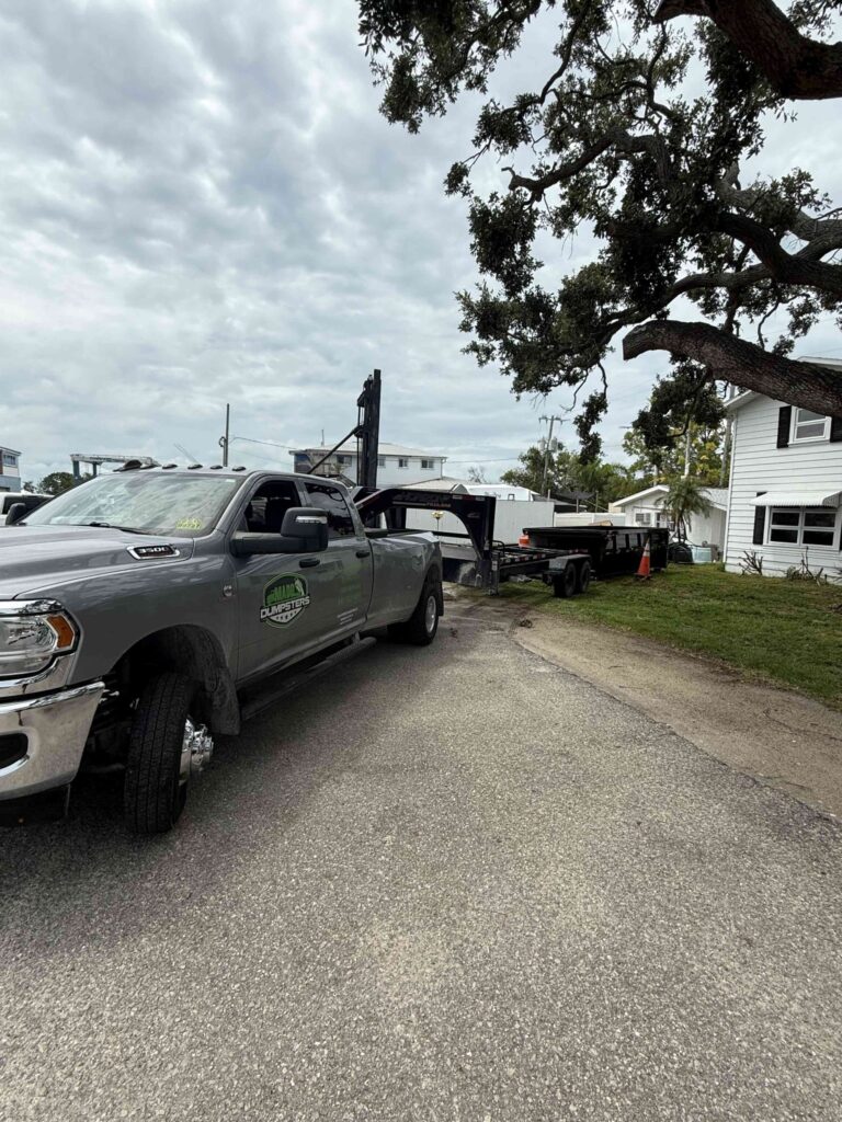 20-yard dumpster in West Bradenton driveway during a roof replacement.