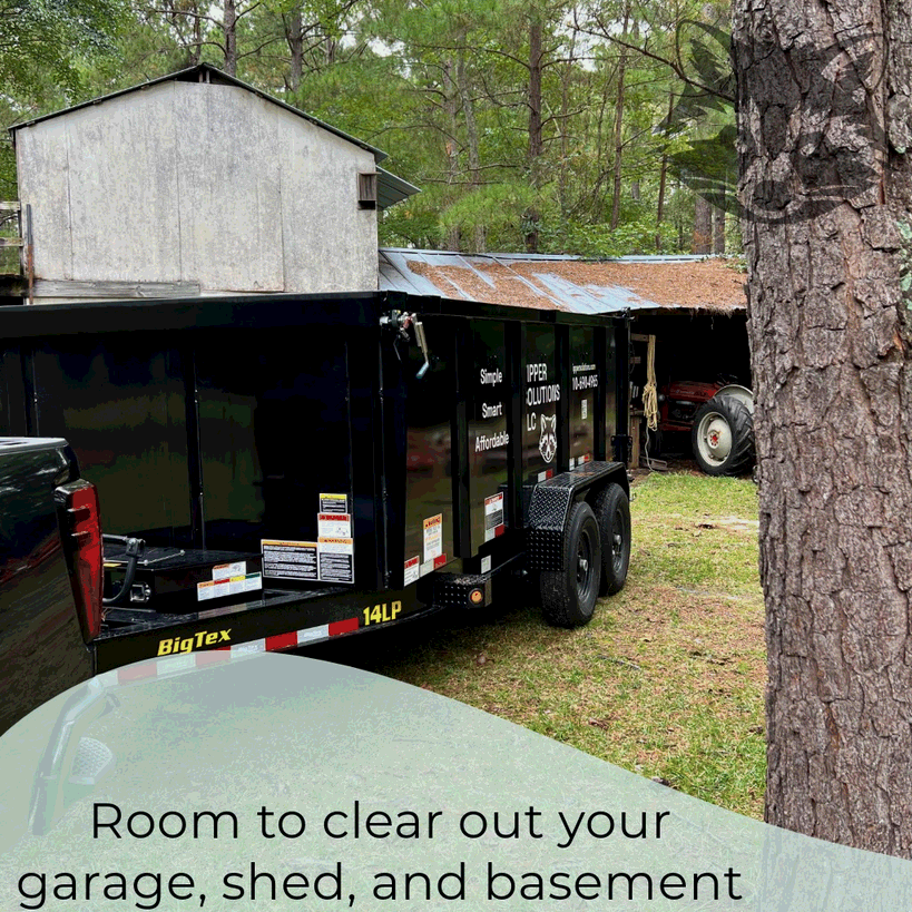 14-yard dumpster trailer parked beside a shed in a residential yard, showcasing household waste disposal capacity in Moore County, NC.