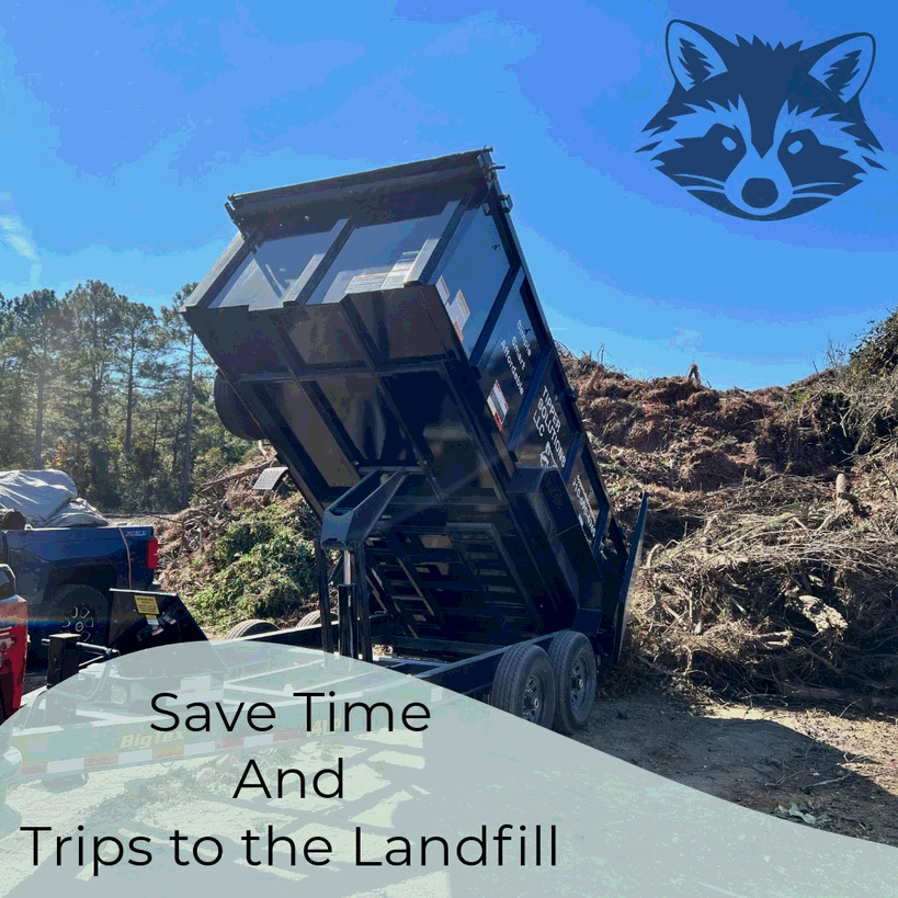 Large pile of yard debris, including pine straw, leaves, and natural waste, being dumped from a black dumpster at a disposal site.